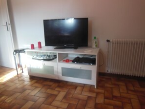 Cozy living space with a flat-screen TV and entertainment unit.