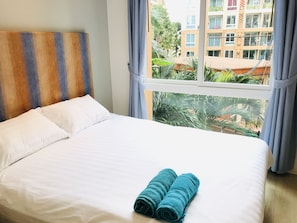 Executive Apartment, 2 Bedrooms, Terrace, Pool View | 2 bedrooms, laptop workspace, blackout drapes, iron/ironing board - Atlantis Condo Resort (Pattaya)