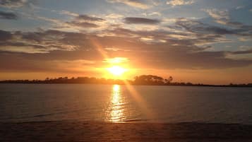 On the beach, sun loungers, beach towels