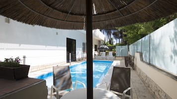 Seasonal outdoor pool, open 9:00 AM to 6:30 PM, pool loungers