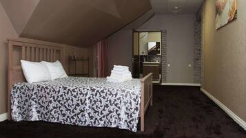 Suite Luxe, 1 très grand lit, non-fumeurs | Bureau, rideaux occultants, Wi-Fi gratuit, draps fournis