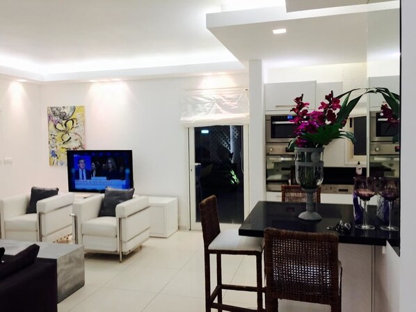 Royal Apartment, 2 Bedrooms, Garden View | Living area | 42-inch flat-screen TV with satellite channels, TV