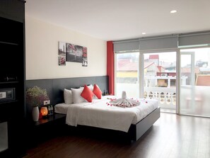 Deluxe Room, Balcony | Premium bedding, in-room safe, desk, blackout curtains