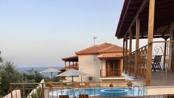 Outdoor pool, open 9:30 AM to 8:00 PM, pool umbrellas, sun loungers