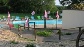 Seasonal outdoor pool, open 9:00 AM to 9:00 PM, pool umbrellas