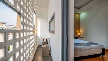 Deluxe Room, Balcony | Minibar, desk, blackout drapes, free WiFi