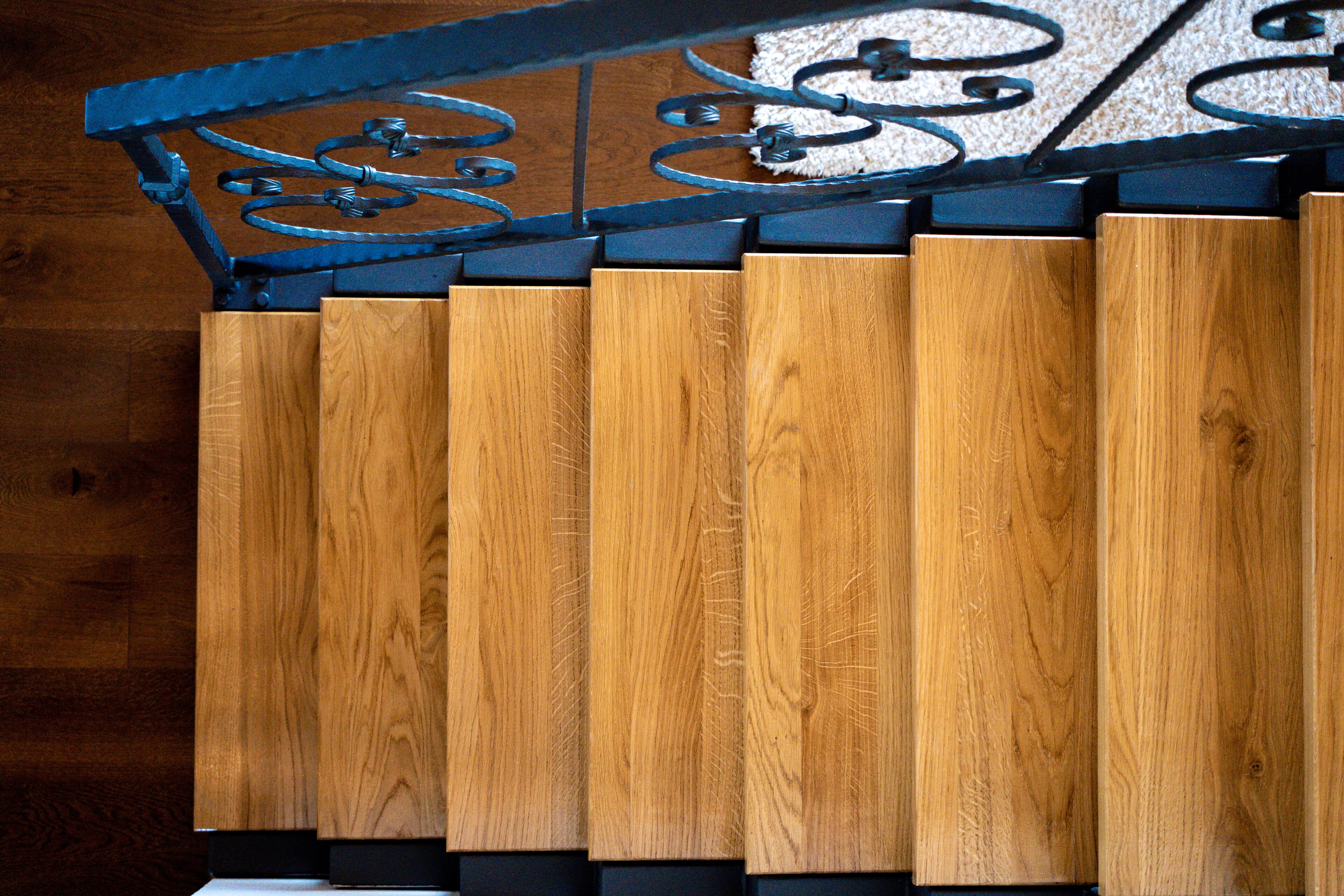 A wooden panel with a metal railing.