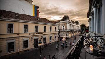 A historic building with a dome and a balcony with candles.