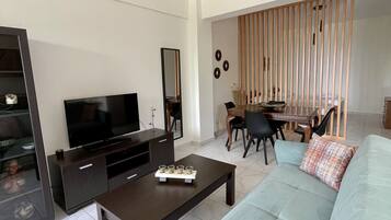 Family Apartment (Ground floor) | Living area | 23-inch flat-screen TV with cable channels, TV