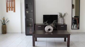 Family Apartment (Ground floor) | Living area | 23-inch flat-screen TV with cable channels, TV