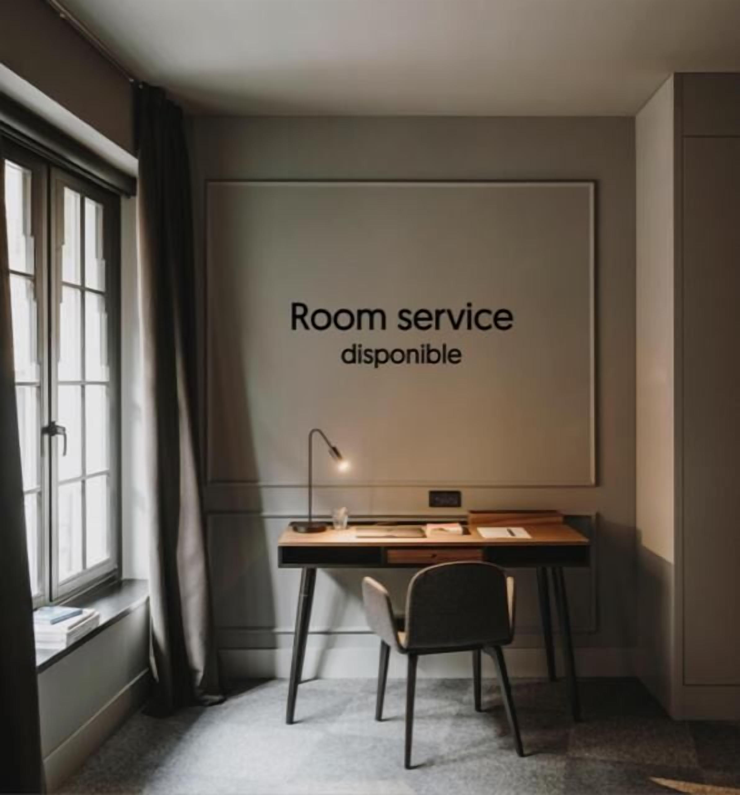 A room with a desk, chair, and a sign indicating room service is available.