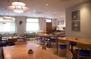 Enjoy meals and social gatherings in this well-appointed dining area with comfortable seating and stylish decor.