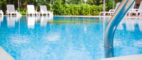 Indoor pool, seasonal outdoor pool, pool umbrellas, pool loungers