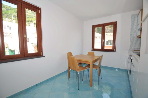 Family Apartment | Private kitchen | Full-size fridge, oven, stovetop, coffee/tea maker