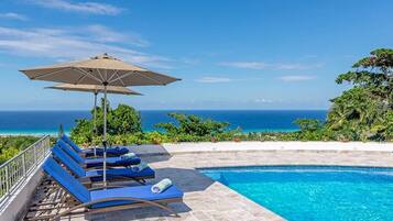 Outdoor pool, pool umbrellas, sun loungers