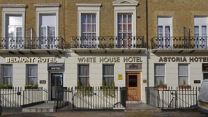 Three hotel buildings named Belmont Hotel, White House Hotel, and Astoria Hotel. Each building has a distinct entrance and a number displayed above the door. - White house Hotel (London)