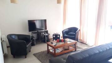 Quarto família | Sala de estar | TV de tela plana