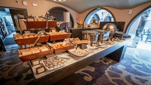 A buffet with various food items and a coffee station. - Costa del Sol Trujillo Centro (Trujillo)