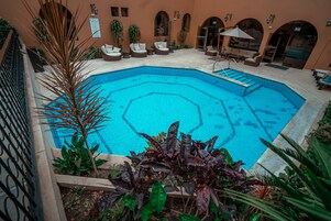 Outdoor pool, open 9:00 AM to 6:00 PM, pool umbrellas, sun loungers