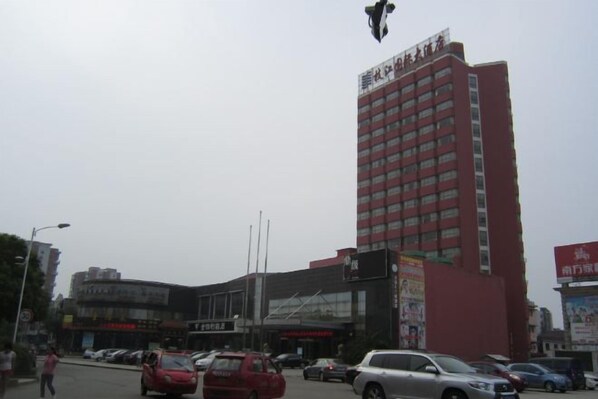 A multi-story building with a prominent sign at the top. - Zhijiang International Hotel (Zhijiang)