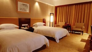A hotel room with two beds, a desk, a chair, and a large window with curtains. - East Lake International Hotel (Yangjiang)