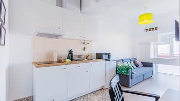 Panoramic Apartment, City View | Private kitchen | Full-size fridge, microwave, stovetop, espresso maker