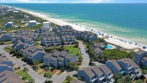 A coastal residential area with beachfront properties, a sandy beach, and a clear blue sky. - Barrier Dunes, Cape San Blas, Community Pools/Tennis - BD 497 (Cape San Blas)