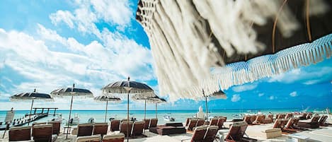 On the beach, sun-loungers, beach towels