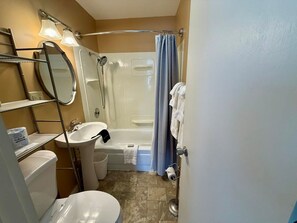 Bathtub, hair dryer, towels