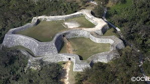 An aerial view of a historical site with stone walls and water features, surrounded by dense forest. - Condominium･yuyuki (Yomitan)