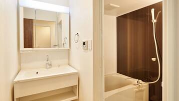 Apartment Type Twin | Bathroom | Combined shower/tub, deep soaking tub, free toiletries, hair dryer