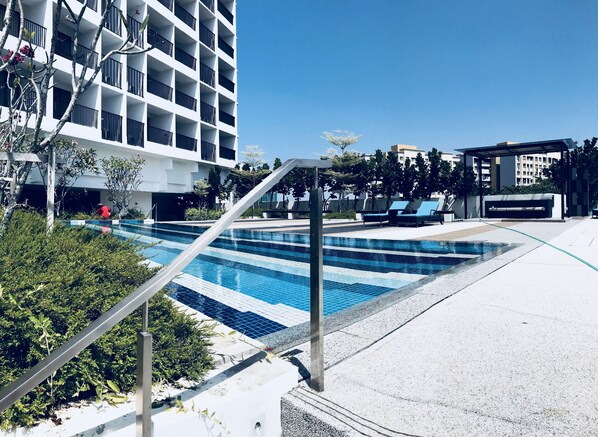 Outdoor pool, open 6:00 AM to 10:00 PM, pool loungers