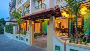 A hotel entrance with a sign reading 'BACKHOME BOUTIQUE,' a tiled entrance, and a checkered floor. - BACKHOME BOUTIQUE OLD TOWN HOI AN (Da Nang)