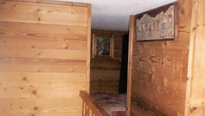 A wooden interior with a wooden staircase and a painting on the wall. - Apartment/ flat - VAL THORENS (Les Belleville)