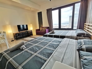 Family Studio Suite, Multiple Beds, City View | Individually decorated, individually furnished, blackout drapes - Tropicana 218 Suites (George Town)