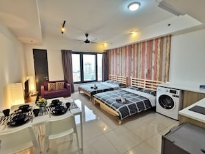 Family Studio Suite, Multiple Beds, City View | Living area | LED TV - Tropicana 218 Suites (George Town)