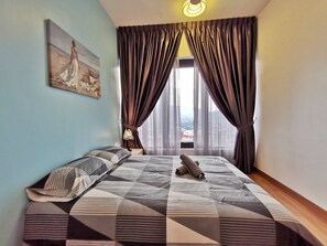 Family Apartment, 2 Bedrooms, City View | Individually decorated, individually furnished, blackout drapes - Tropicana 218 Suites (George Town)