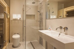 Shower, hair dryer, towels, toilet paper