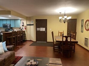 A compact living space with a dining area, kitchen, and seating area. - Giant Steps 63 - Walkout to the slopes (Brian Head)