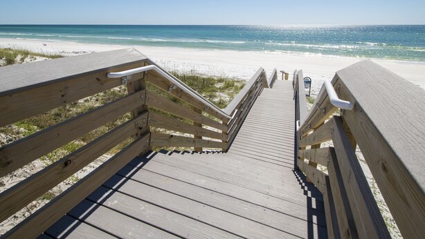 A wooden boardwalk leading to a beach with clear skies. - Modern Studio Apartment., Sleeps 4, Steps to the Beach! (Santa Rosa Beach)