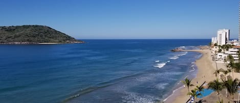 On the beach, sun-loungers, beach towels