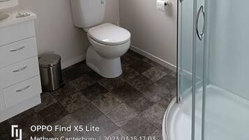 Bathtub, hair dryer, towels, soap