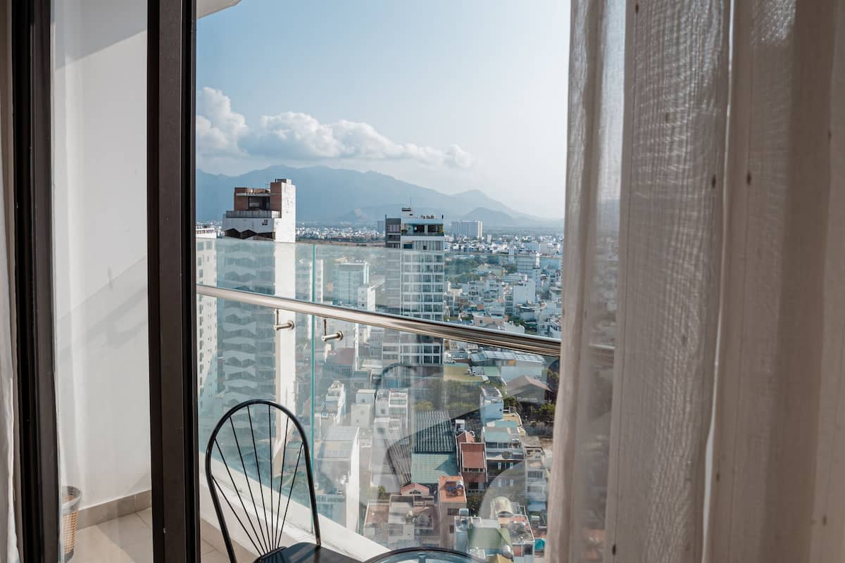 deluxe quadruple room, 1 bedroom, city view | 1 bedroom, minibar, in-room safe, desk