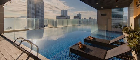 Outdoor pool, open 8:00 AM to 10:00 PM, sun loungers