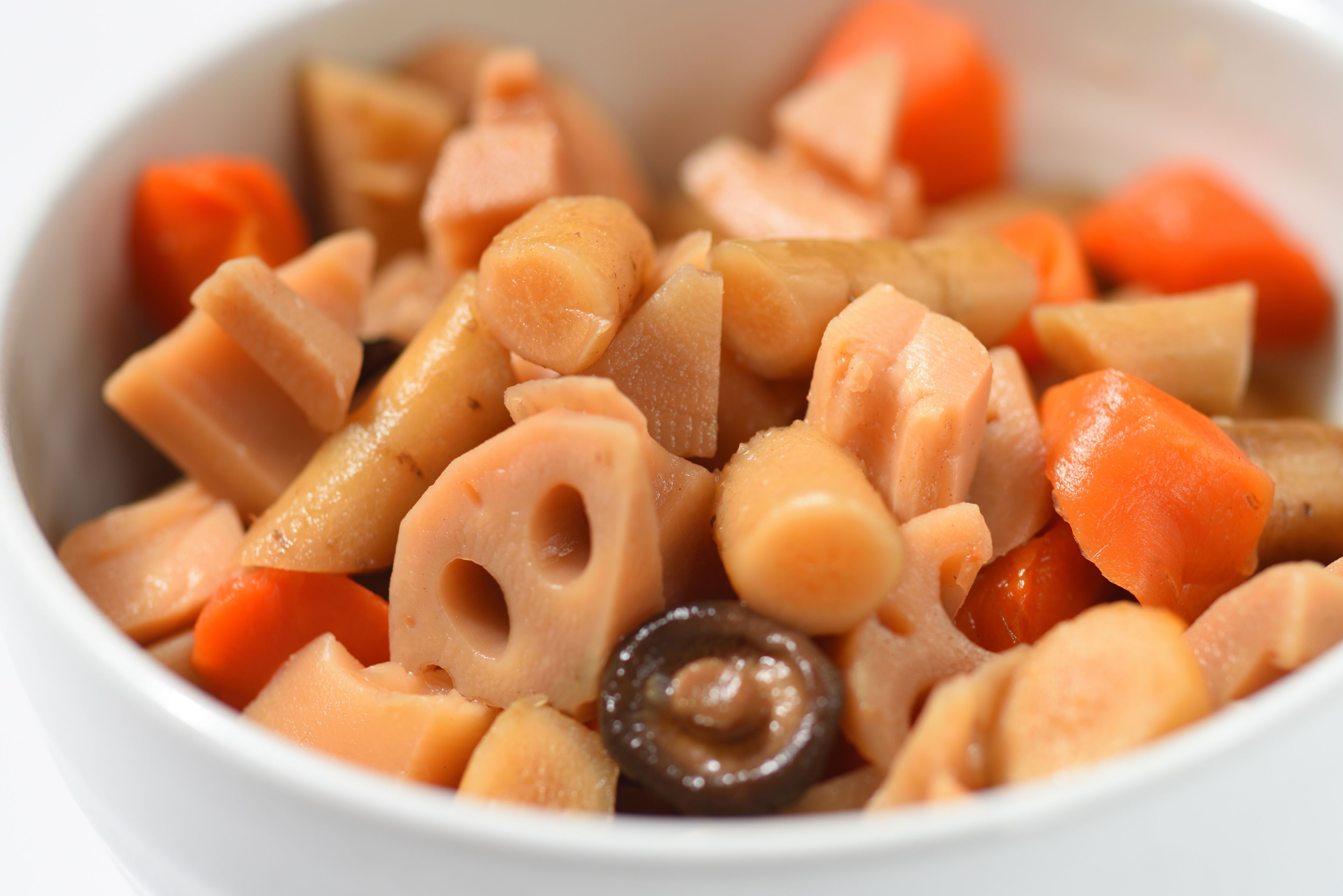 A bowl of food with various ingredients.