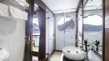 Shower, free toiletries, slippers, towels