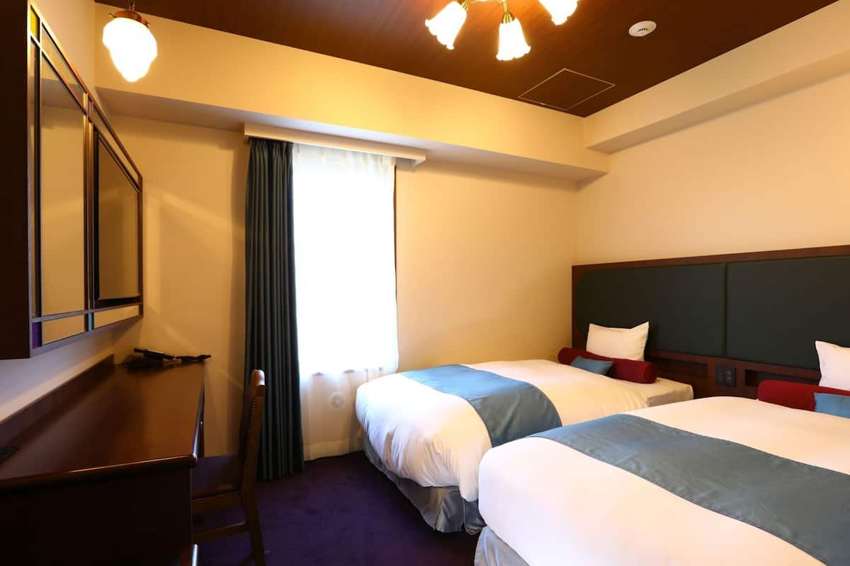 Down duvets, desk, laptop workspace, blackout curtains