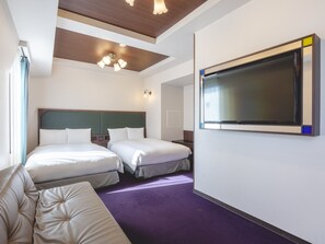 A hotel room with two beds, a large flat-screen TV, a sofa, and a ceiling with wooden beams and a chandelier. - KOKO HOTEL Ikebukuro (Tokyo)