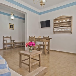 Family Apartment, 1 Bedroom | Living area | 28-inch flat-screen TV with cable channels, TV