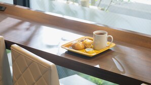 A dining table with a tray of food and a cup of coffee. - KOKO HOTEL Shimbashi Onarimon (Tokyo)